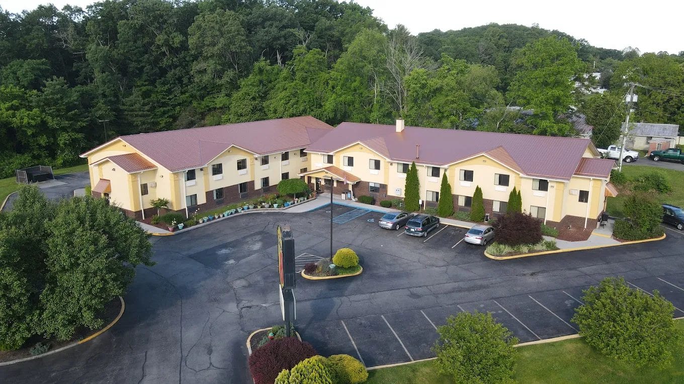 Aerial view of a commercial building complex with new roofing