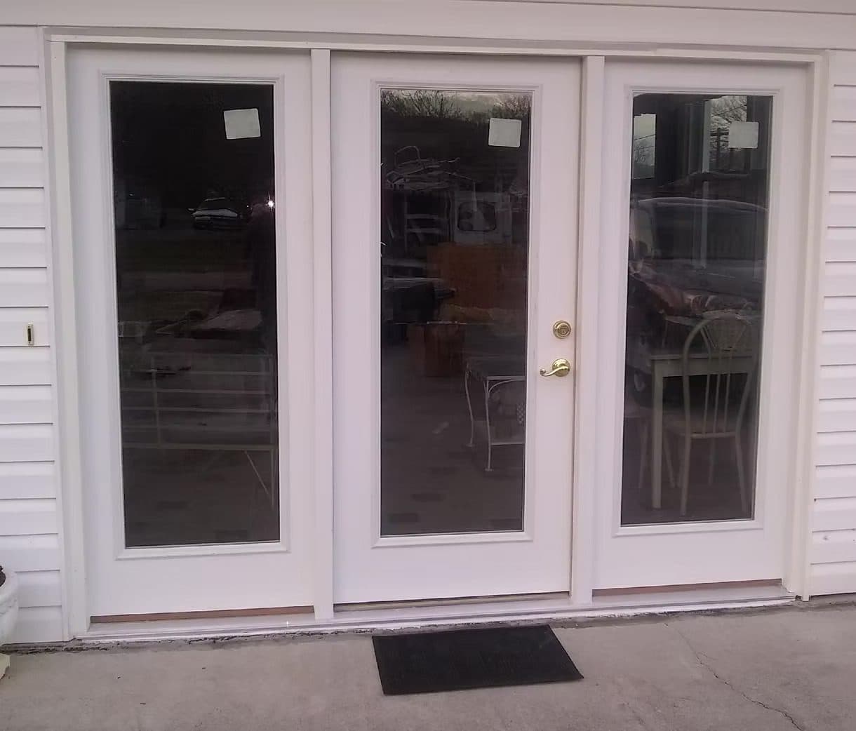 Three-panel white French patio door, viewed from inside