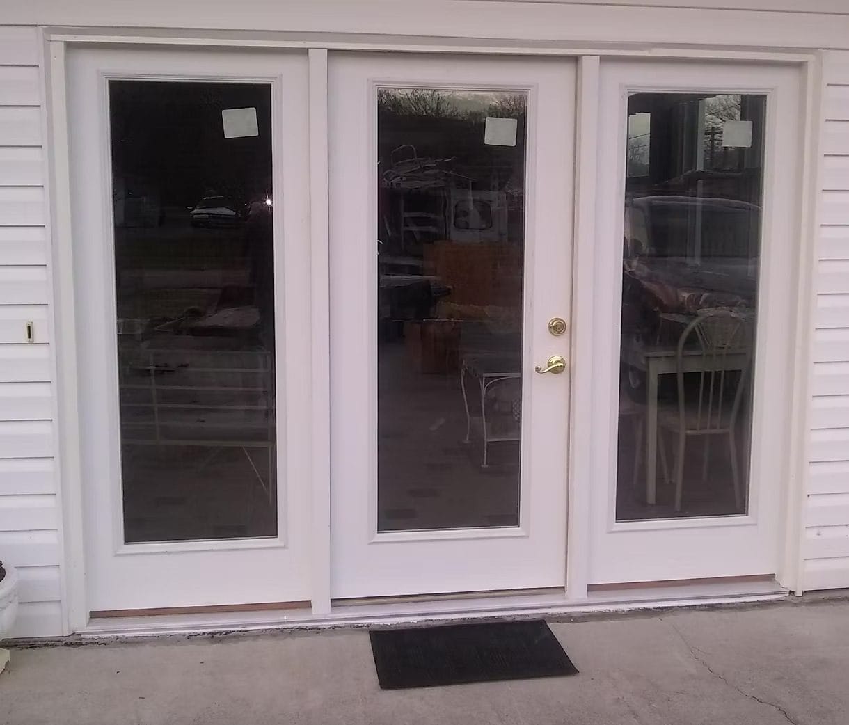 Three-panel white French patio door, viewed from inside